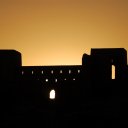 Sunset behind the fortress like city walls