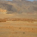 Initially built as temporary housing for returning war refugees, this collection of mud brick homes has become a permanent settlement in the dry foothils of the Kohi Safed Mountains