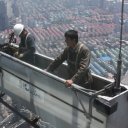 Window washers outside the Shanghai Financial Building
