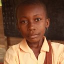 Girl-posing-for-a-photo-in-a-rural-Ghana-classroom