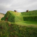 A-rather-large-and-windowless-sod-roof-house-out-in-the-countryside-most-likely-used-as-a-barn