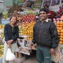 Happy fruit vendor and customer