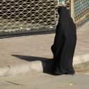 Throughout-most-of-Iran-women-are-required-to-wear-a-black-all-encompassing-veil-which-only-shows-the-face-and-nothing-else