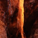 Colorful-canyon-walls-sunlight-shining-through-Wadi-Rum