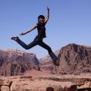 Girl-jumping-high-into-the-sky-Wadi-Rum