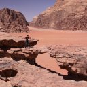 Natural-rock-bridge-with-woman-standing-for-comparison-of-scale