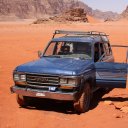 Our-beat-up-truck-in-the-middle-of-the-wide-expanses-of-Wadi-Rum39s-desert