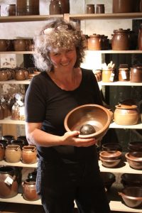 Åsa proudly displaying a finished bowl