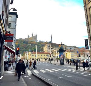 View from the elegant Presqu’ile neighbourhood looking into the Basilique Notre-Dame de Fourvière high atop the Fourvière Hill, with the old town below it just across the River Saône.