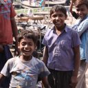 Happy kids playing near the Buriganga River