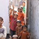 Kids in doorway at the entrance to their school, Dhaka