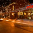 A-bus-zips-past-on-a-lit-up-street-in-downtown-Denver