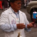 Gentleman on streets of Quito selling sweets