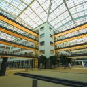 The-inner-courtyard-of-a-Hospital-is-covered-by-a-large-glass-roof-that-can-slide-open-during-the-summer-to-take-maximum-advantage-of-good-weather