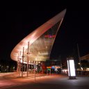 Very-interestingly-shaped-awning-for-a-bus-depot-taken-at-night-and-lit-by-lights-from-below