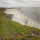 Gullfoss-one-of-Icelands-bigger-waterfalls-sends-a-plume-of-mist-skyward-as-it-plunges-hundreds-of-feet-down-into-a-cataract