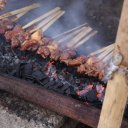Pork-roasting-over-open-coals-sidewalk-vendor-Bali