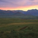 The sunset finally breaks through the rain clouds at the end of the day. The valley is heavily cultivated with millet and maize the major crops