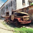 The burned out wreck of a military truck points to the country\'s war ravaged past