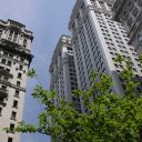 Looking-up-at-tall-buildings-near-Trinity-Church