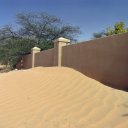 Sand against Oasis Walls, Oman