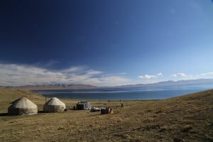 An oasis in a remote area - Yurts along the shoreline of Song-Kul Lake