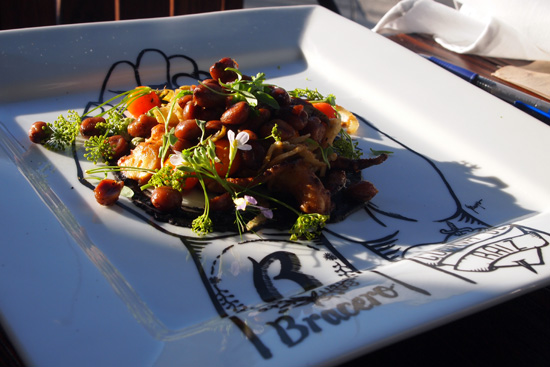 WOOD GRILLED OCTOPUS: black bean & squid ink sauce / achiote / green garbanzo / habanero-peanut salsa