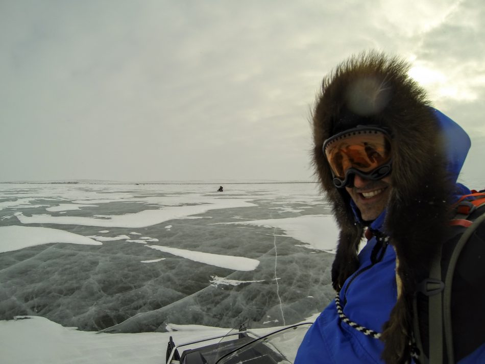 Bruno and I snowmobiling across the frozen Mackenzie River