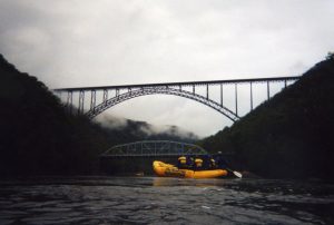 Two bridges are visible from the New River, the New River Gorge Bridge and the Fayette Station Bridge. 