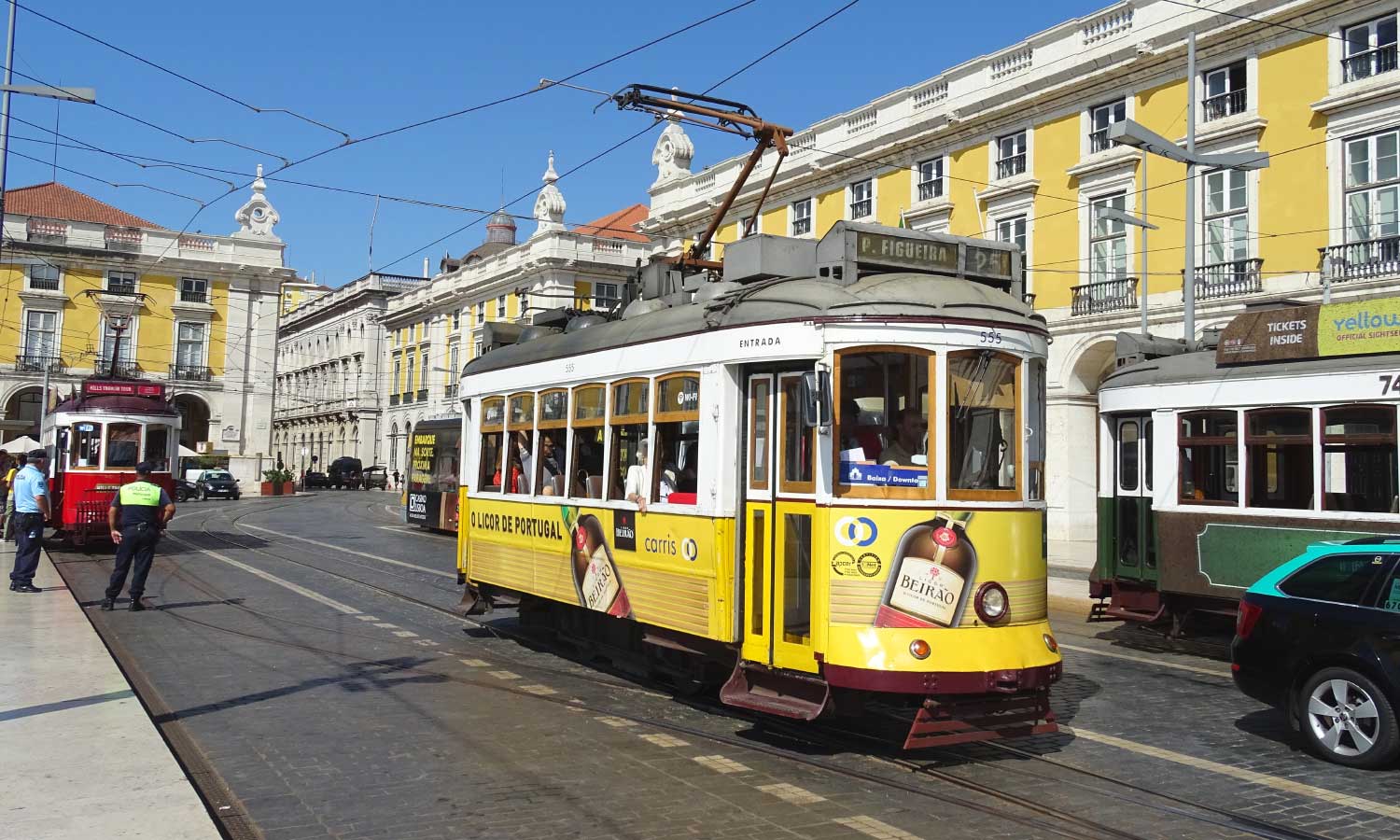Getting around in Lisbon - Shows a tram on the streets of Baixa