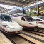 3 different trains parked up at a train station in Spain