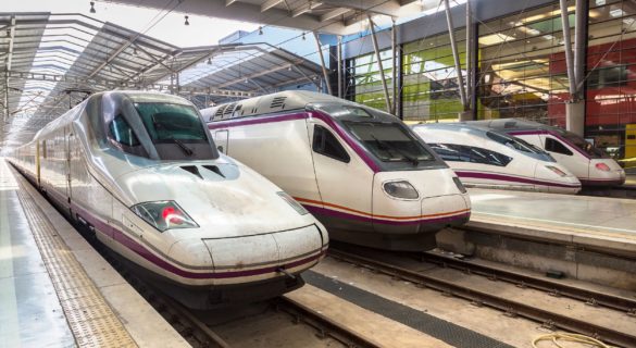 3 different trains parked up at a train station in Spain