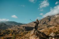 Man taking a selfie while hiking.