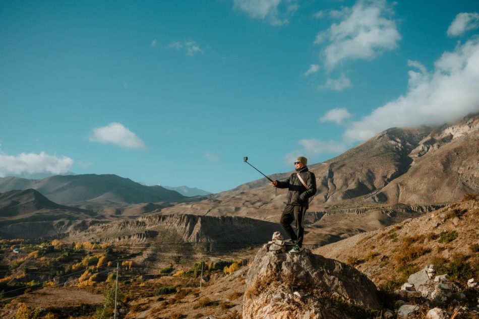 Man taking a selfie while hiking.