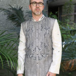 Man wearing a custom Barong Tagalog with black embroidery