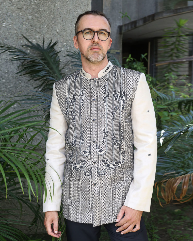 Man wearing a custom Barong Tagalog with black embroidery