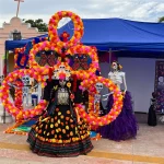 Woman in a Catrina-style costume posing at the Hanal Pixán/Day of the Dead festival in Puerto Juárez, Cancún.